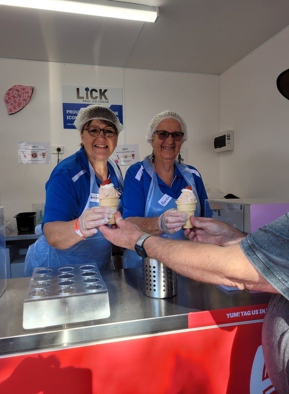 asbestos disease support society volunteers serving Ekka Strawberry Sundaes for The Common Good